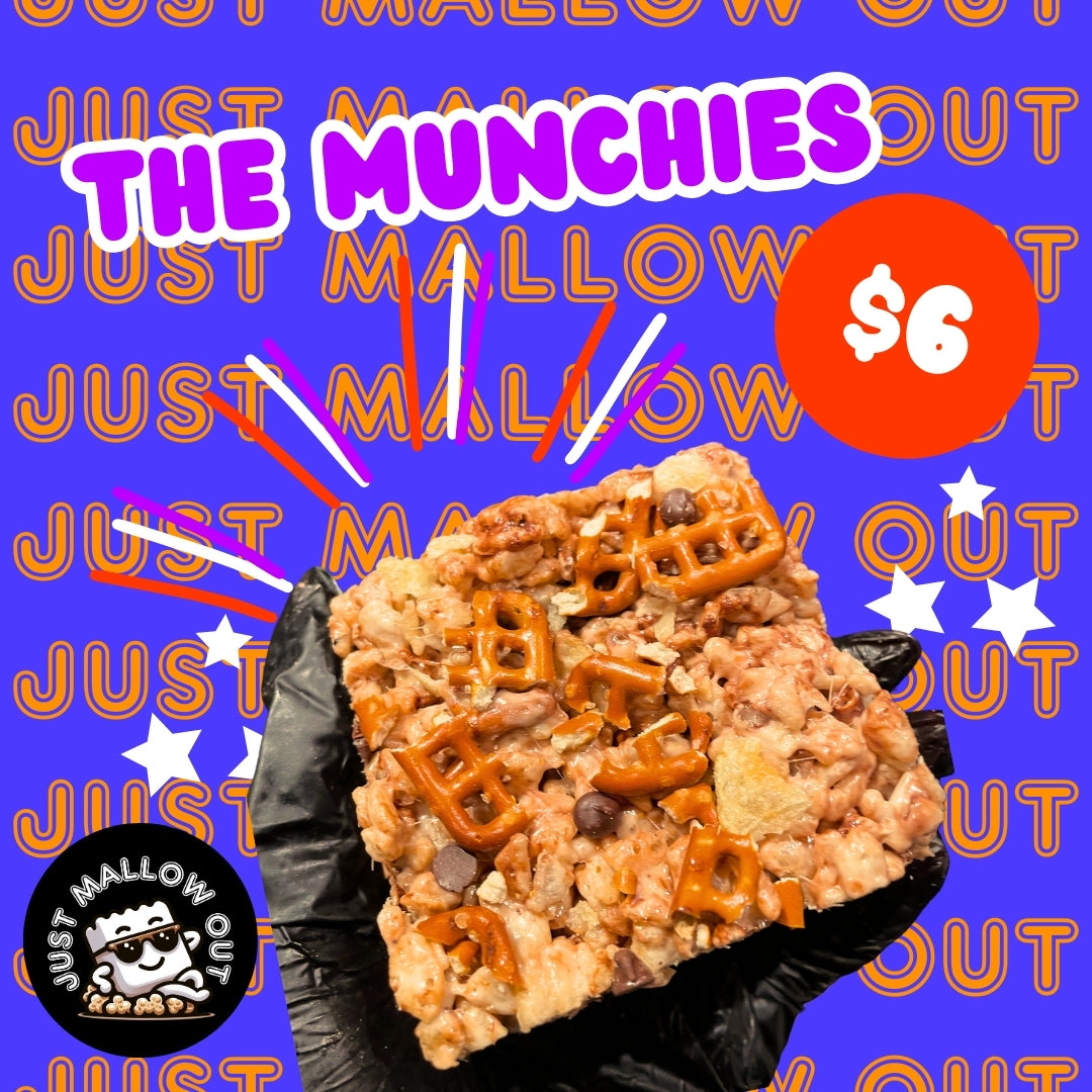 The image showcases a Rice Krispies treat called "THE MUNCHIES" by JUST MALLOW OUT, priced at $6. It's centered against a blue background with repeating brand text and dynamic graphics. Toppings include pretzels and chocolate, and the brand's marshmallow chef logo adds a playful touch.