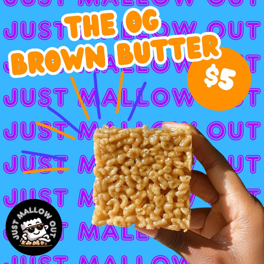 The image is a playful advertisement for "THE OG BROWN BUTTER" Rice Krispies treat, priced at $5. A hand is holding the treat against a bright blue background with vibrant orange and purple text reading "JUST MALLOW OUT" repeatedly. The brand's smiling marshmallow chef logo is visible, adding to the fun vibe.